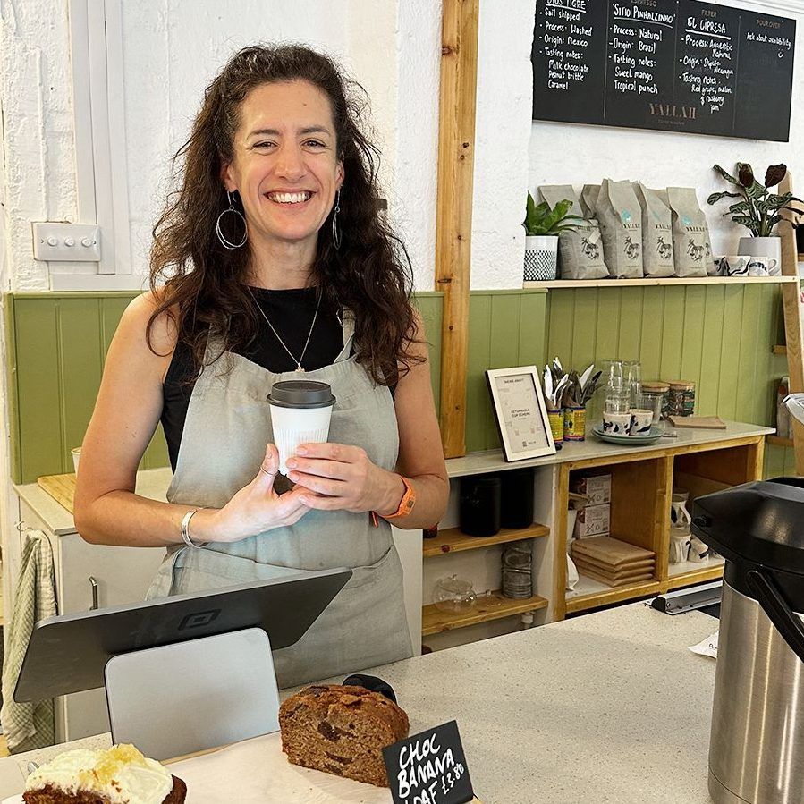 woman holding returnable cup